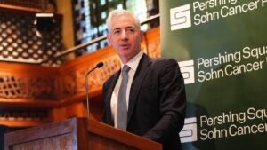 Bill Ackman speaking from behind a podium.