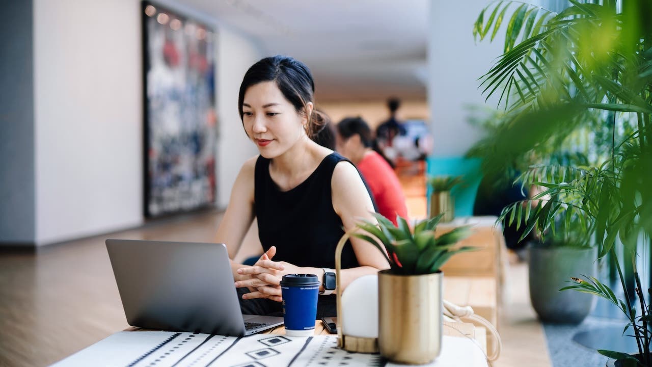 Young Asian businesswoman working in a modern office space