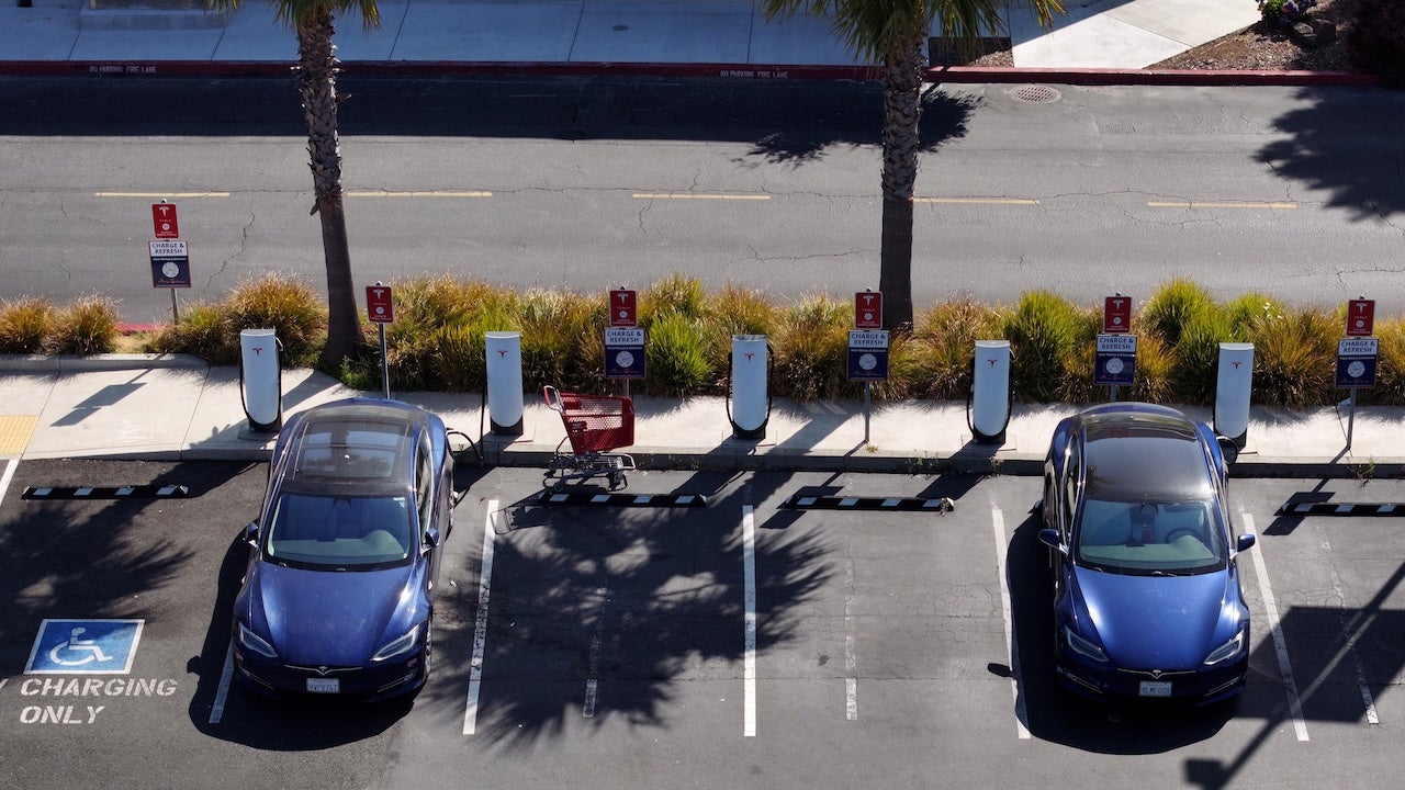 Electric vehicles parked at a charging station in California, EV tax credits may end