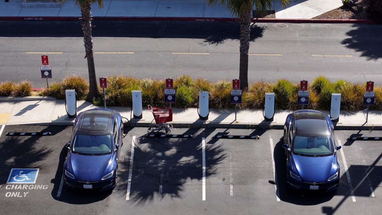 Electric vehicles parked at a charging station in California, EV tax credits may end