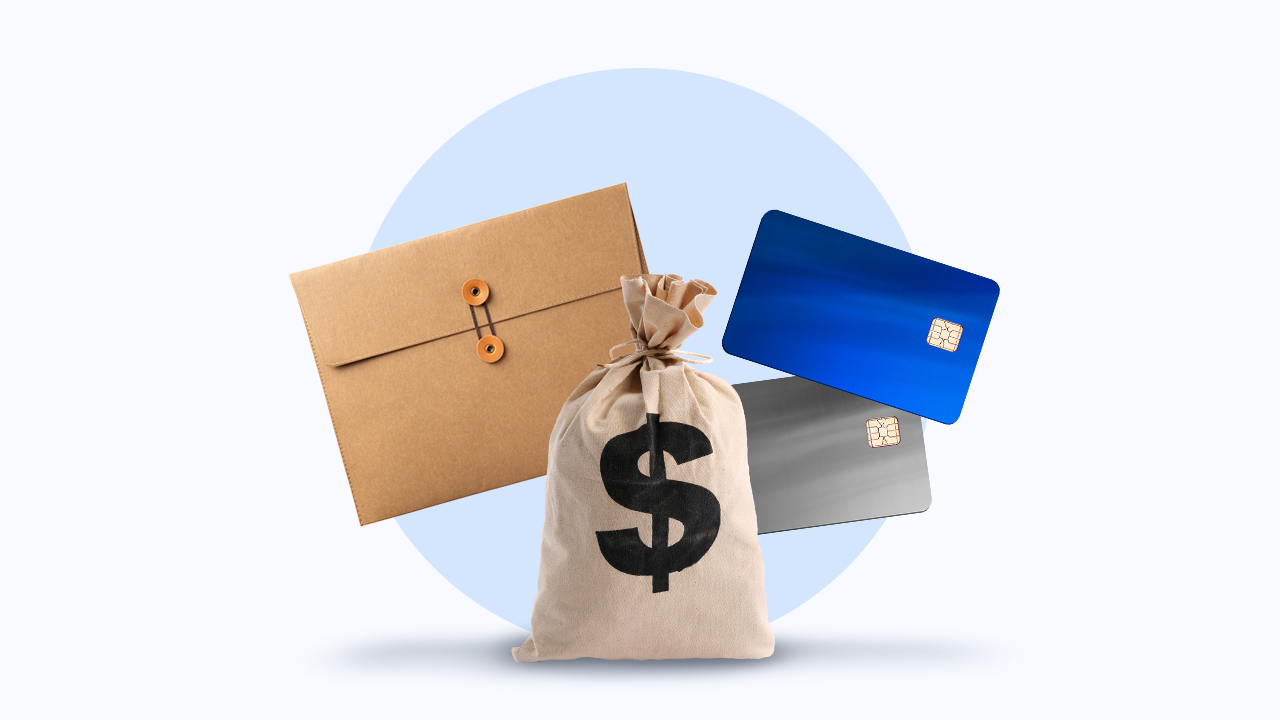 A giant money bag, two credit cards, and a file folder