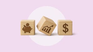 Three light blonde colored wooden blocks in a row with the following painted images: a piggy bank with a coin goin into it's slot, a bar graph and line rising from left to right, and a dollar sign.