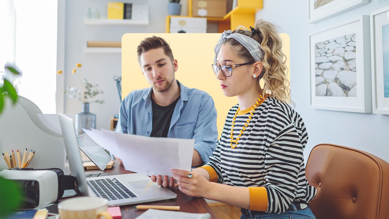 Man and woman creating business plan