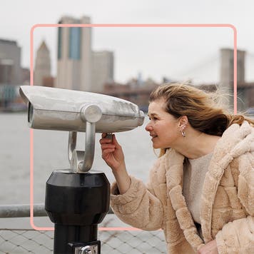 Person looking through telescope